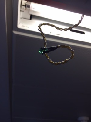 Function of a Small Green LED on Fluorescent Strip Light  - small green light bulb on wire