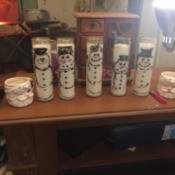 Waving Snowman Candles - several snowman candles  on table top