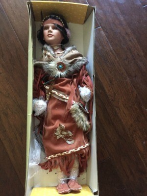 Identifying a Porcelain Doll - doll wearing Native American style clothing