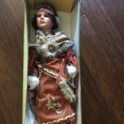 Identifying a Porcelain Doll - doll wearing Native American style clothing