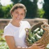 Woman With Summer Squash Harvest