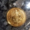 Identifying a Collectible Doubloon - gold colored doubloon with an Hindu deity motif of Lakshmi