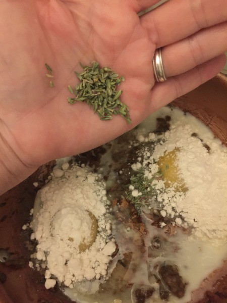 adding thyme to skillet