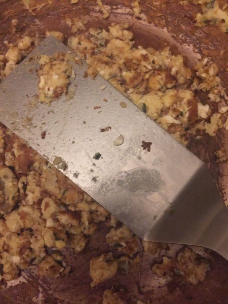 pressing down scrambled eggs