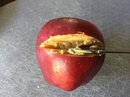 Fruit Monsters - smear the peanut butter in the notch for the mouth