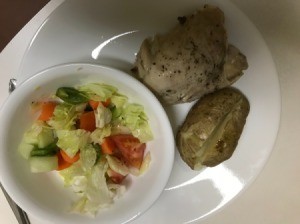 Pressure Cooker Chicken Thighs on plate with potato and salad