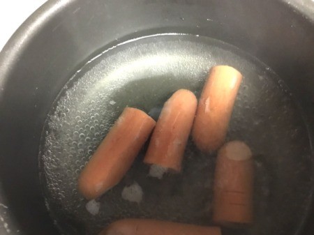 hotdog fingers cooking in pan