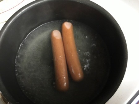 hotdog fingers cooking in pan