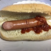 hotdog on bun with catsup