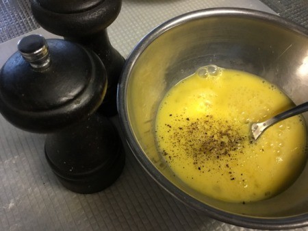 mixing egg for omelet