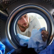 Man Looking at His Laundry