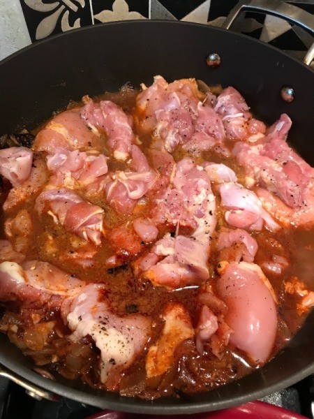 Chicken added to wok