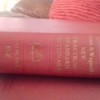 A Funk and Wagnalls dictionary with a red cover.