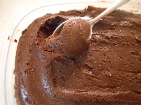 removing spoonful of frozen dough