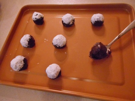placing cookie dough on baking sheet