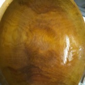 A wooden serving bowl that has been oiled with mineral oil to preserve it.