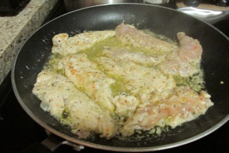 cooking marinated Chicken in pan
