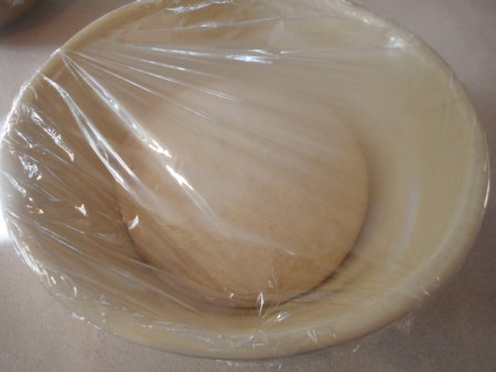 plastic covered dough resting to double in bulk