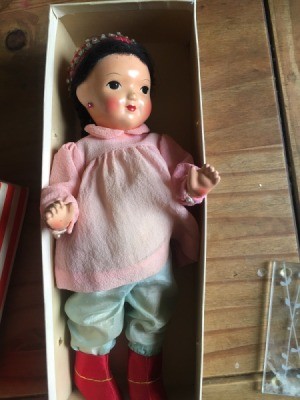 Identifying a Porcelain Doll - doll with painted face, in an old box