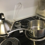 Built in Spoon Rest - wire whisk handle in the hanging hole on a pot handle
