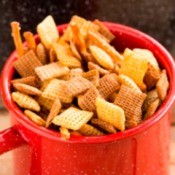 Chex party mix in a red cup.