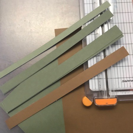 Christmas Tree Holiday Card - cut strips of green construction paper for tree and one brown for trunk