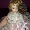 Identifying a Goldenvale Porcelain Doll - doll wearing a pink and white lace dress