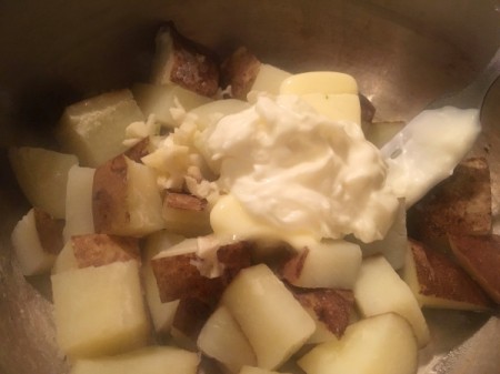 adding yogurt to potatoes