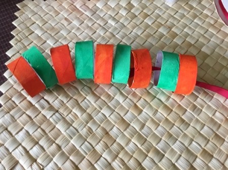 Cardboard Tube Christmas Ring Wreath - thread rings onto red ribbon