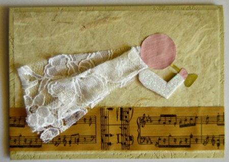 Angel Blowing On Trumpet Christmas Card - cut a horn from the printer paper and color gold and glue in place, add a hand cut from the pink painted portion of the paper and glue, then cut a sleeve from the glitter foam and glue in place