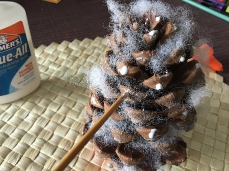 Christmas Pinecones - add dots of glue to tips of pinecone and let set up a bit
