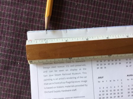 Upcycled Calendar Christmas Wreath - make 1 inch marks on the open and folded edges