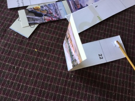 Upcycled Calendar Christmas Wreath - glue each strip together to form a teardrop shape