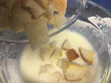 bread cubes added to milk and egg