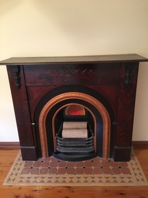 An antique wooden mantlepiece.