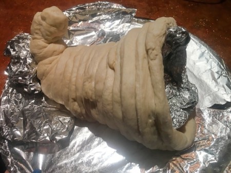 wrapping dough around form