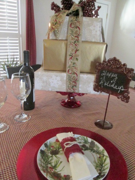 Recycled Boxes as Festive Centerpieces - holiday stack with greetings and wine