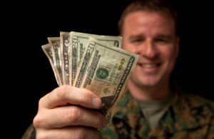 Military Serviceperson Holding Cash