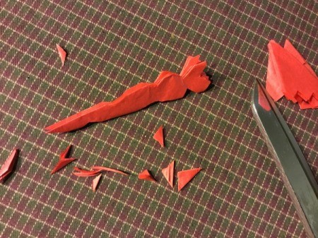 Thrifty Holiday Gift Wrapping - cut little shapes on both sides of the folds