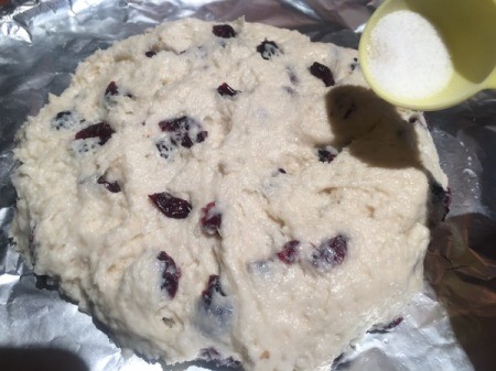 sprinkling dough with sugar