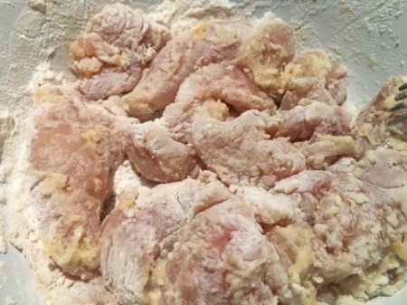 floured, marinated chicken pieces