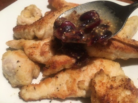 spooning sauce on chicken