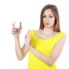 Woman Holding Glass of Smelly Water