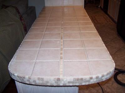 A tiled island counter.