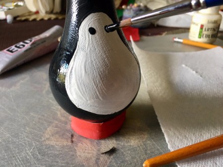 Upcycled Light Bulb Penguin - draw on eyes with paint brush