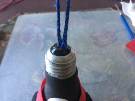 Upcycled Light Bulb Penguin - glue loop of yarn to top of bulb
