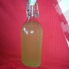 A bottle of homemade Miracle Orange Oil Cleaner.