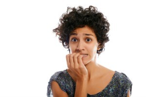 Woman biting her nails.