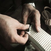 Shoemaker fixing shoes.