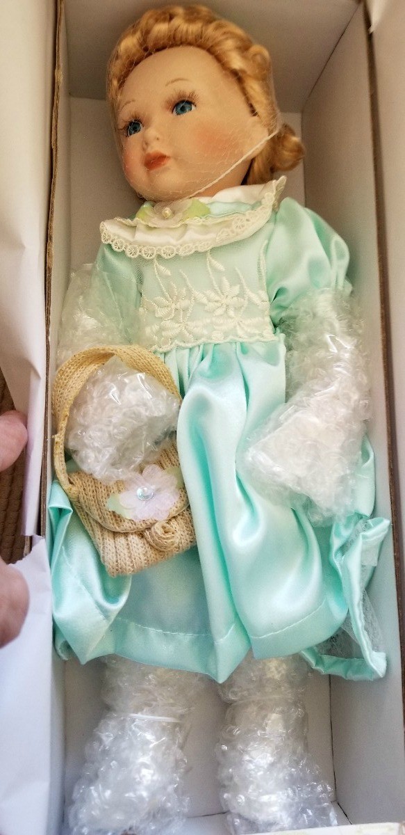 Value of Porcelain Dolls - doll in blue outfit